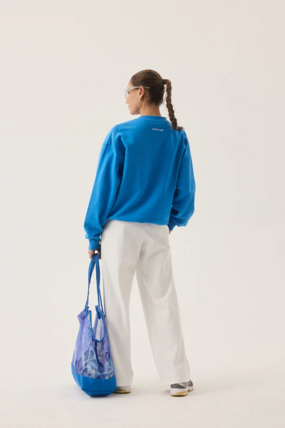 Vacation Sporty Pant by Araminta James — a white wide-leg sports-sheen pant with velour trims and elastic waist, perfect for relaxed styling.