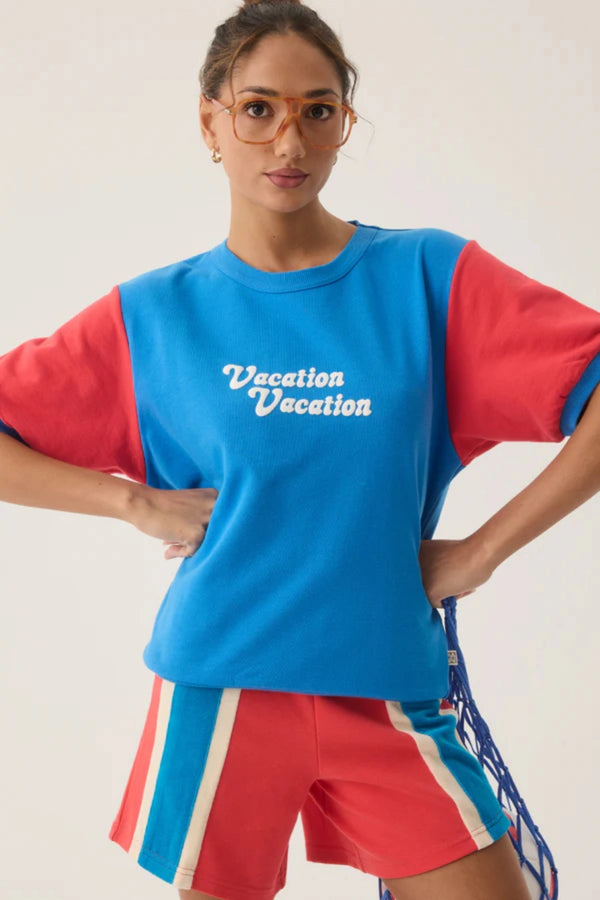Vacation Top French Blue by Araminta James, cotton fleece tee with retro 70’s graphic and crew neckline, a trendy sporty-chic piece perfect for casual days.