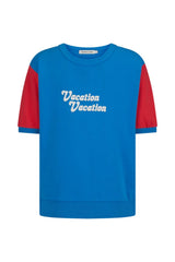 Vacation Top French Blue by Araminta James, cotton fleece tee with retro 70’s graphic and crew neckline, a trendy sporty-chic piece perfect for casual days.