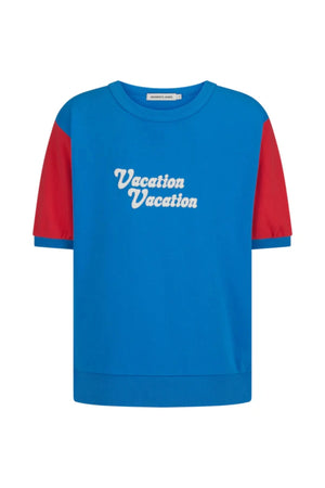 Vacation Top French Blue by Araminta James, cotton fleece tee with retro 70’s graphic and crew neckline, a trendy sporty-chic piece perfect for casual days.