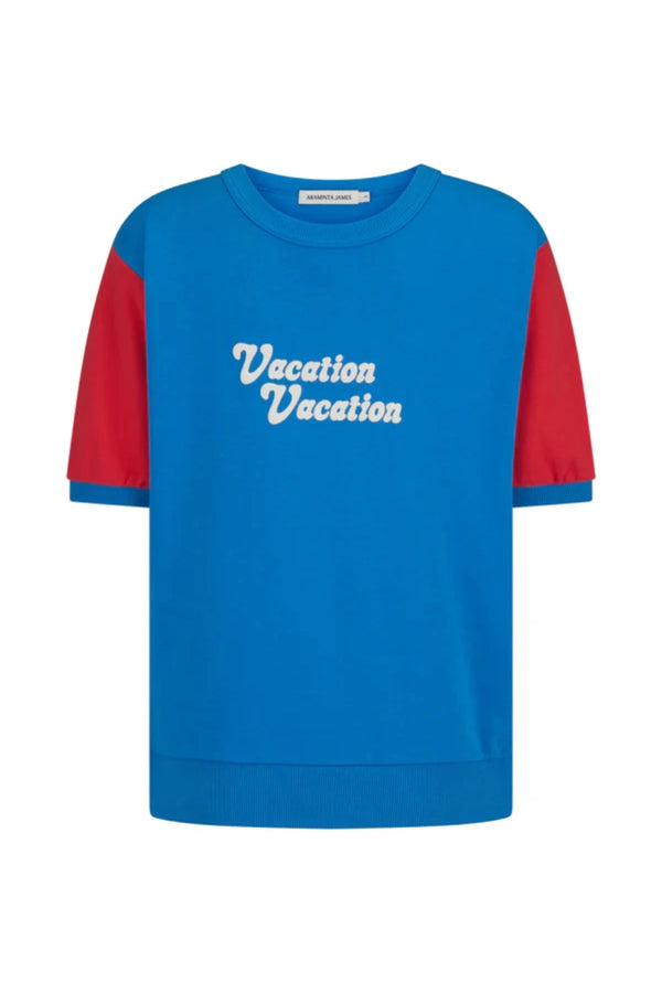 Vacation Top French Blue by Araminta James, cotton fleece tee with retro 70’s graphic and crew neckline, a trendy sporty-chic piece perfect for casual days.