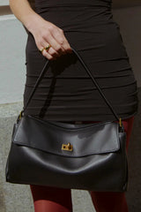 Valentina Bag Black by Reh Studios – a structured leather bag with adjustable strap and dual compartments. Perfect for everyday wear.