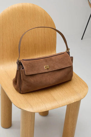 Valentina Bag Suede by Reh Studios – a structured suede and leather bag with adjustable strap. Perfect for chic everyday wear.