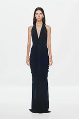 Venus Gathered Cupro Maxi Dress by Misha, a black plunging halter gown with ruched draping and mermaid hem. Perfect for formal events.
