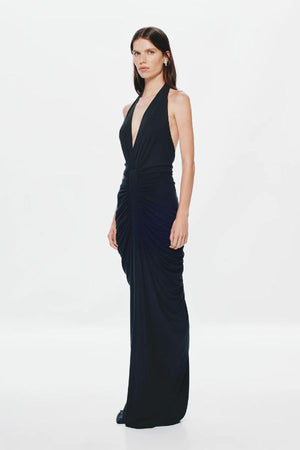 Venus Gathered Cupro Maxi Dress by Misha, a black plunging halter gown with ruched draping and mermaid hem. Perfect for formal events.
