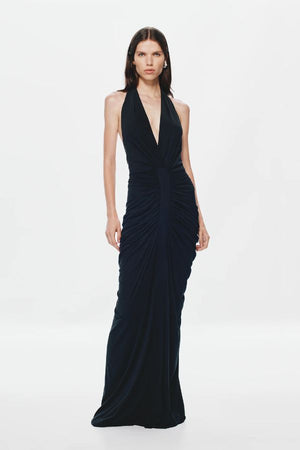 Venus Gathered Cupro Maxi Dress by Misha, a black plunging halter gown with ruched draping and mermaid hem. Perfect for formal events.
