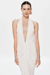 Venus Gathered Cupro Maxi Dress by Misha, a plunging halter style with ruched draping and mermaid hem. Perfect for elegant evenings.