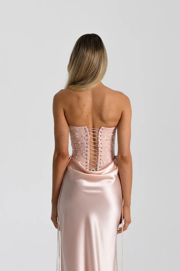 Verity Bustier in Baby Pink by Natalie Rolt, a strapless corset bodysuit with lace-up back and boning. Perfect for elevated formal looks.