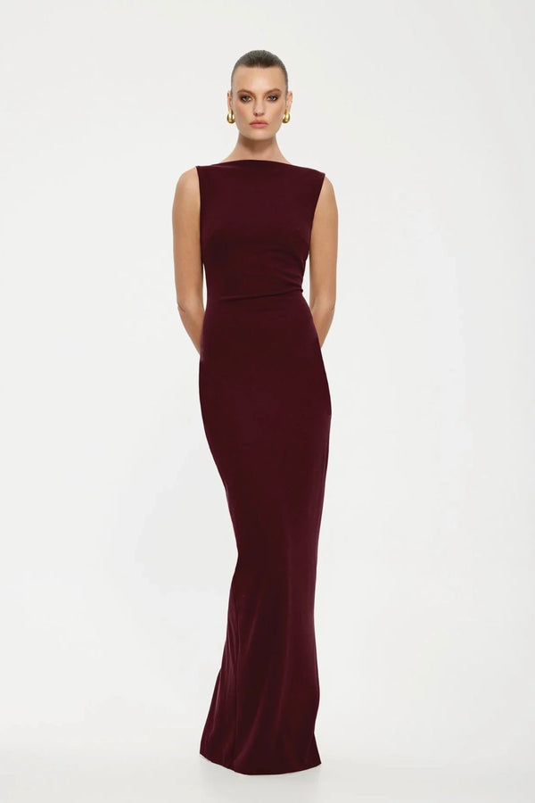 Verona Gown Wine by Effie Kats, a sleek '90s-inspired gown in stretch-crepe with a high neckline and close fit. Perfect for elegant occasions, finished with a fully lined design.