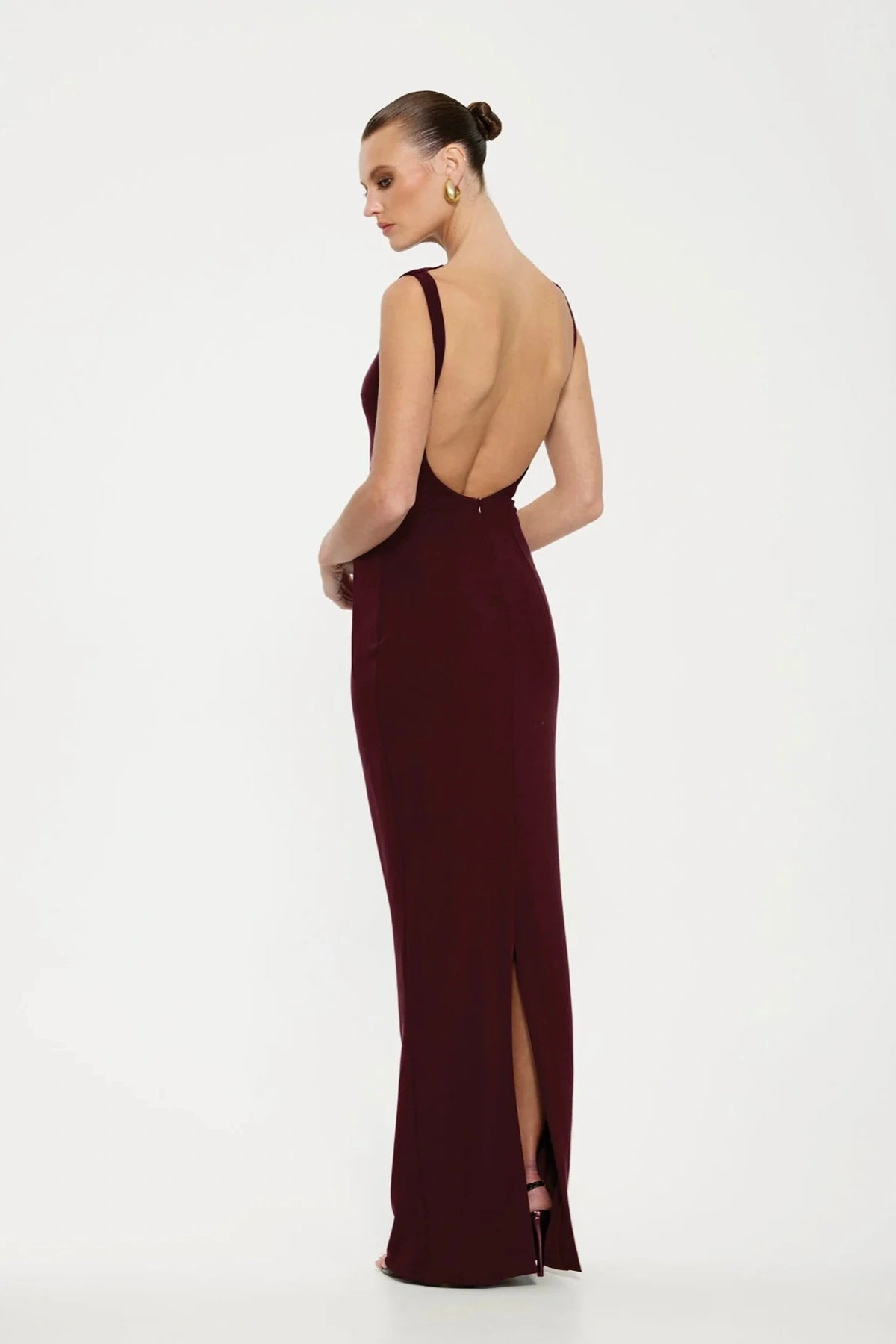 Verona Gown Wine by Effie Kats, a sleek '90s-inspired gown in stretch-crepe with a high neckline and close fit. Perfect for elegant occasions, finished with a fully lined design.