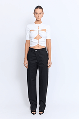 Vicolo Top Powder by Pfeiffer – a fitted tee with cutout detail and hardware. Perfect for edgy everyday styling.