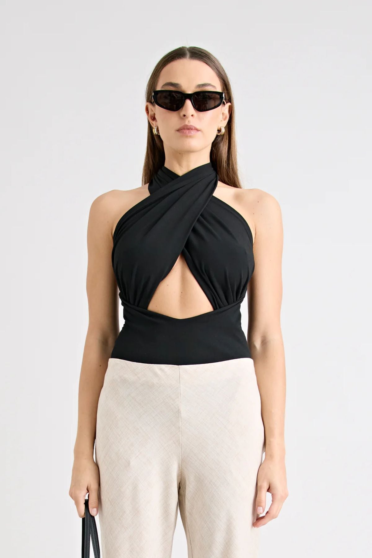 Victoria Top Black by Pfeiffer, sculpting wrap-style jersey top with double lining and adjustable ties for a sleek, curve-enhancing fit.