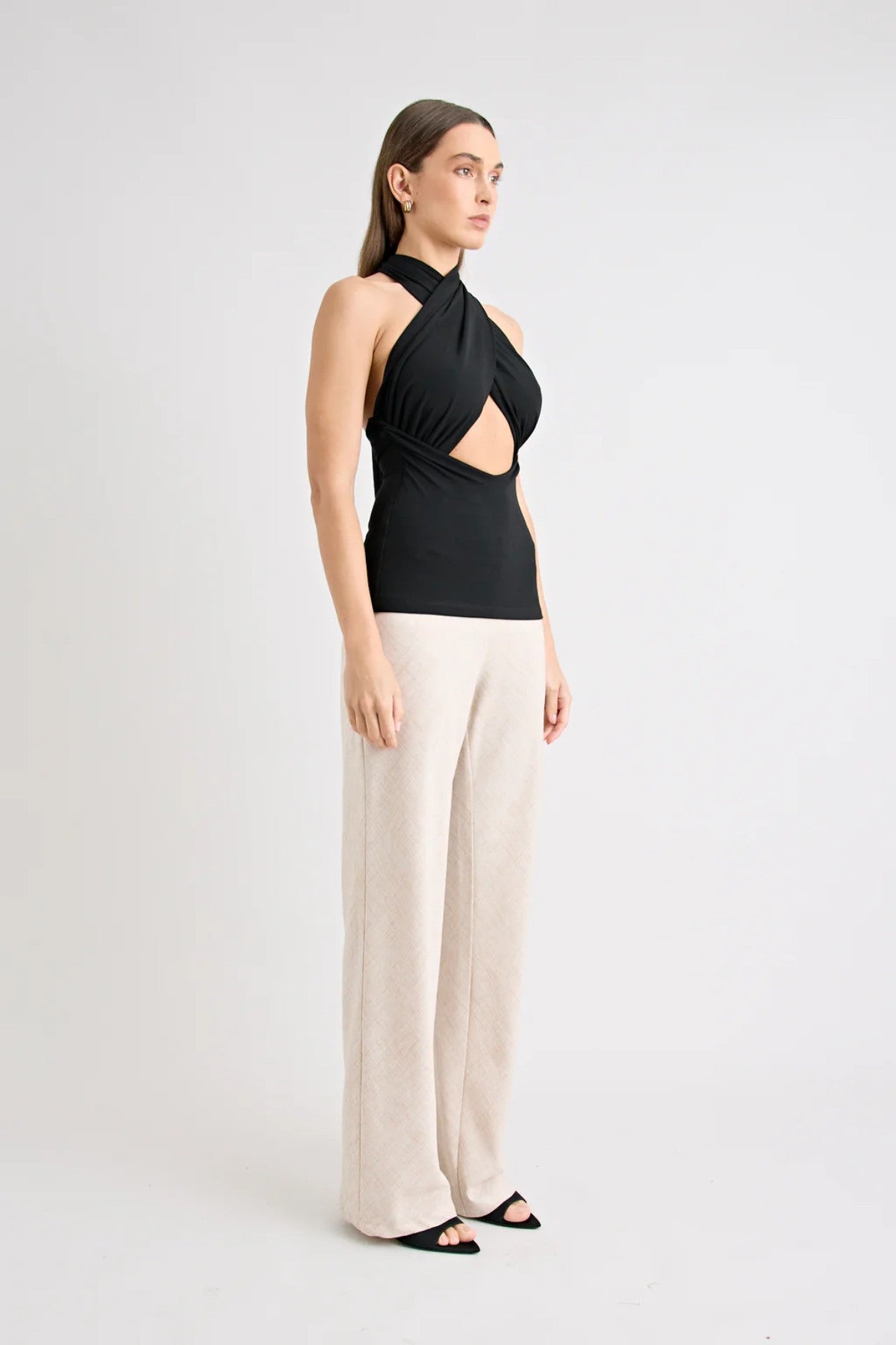 Victoria Top Black by Pfeiffer, sculpting wrap-style jersey top with double lining and adjustable ties for a sleek, curve-enhancing fit.