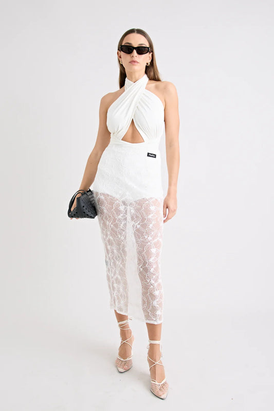 Victoria Top Powder by Pfeiffer, sculpting wrap-style jersey top with double lining and adjustable ties for a flattering, curve-hugging fit.