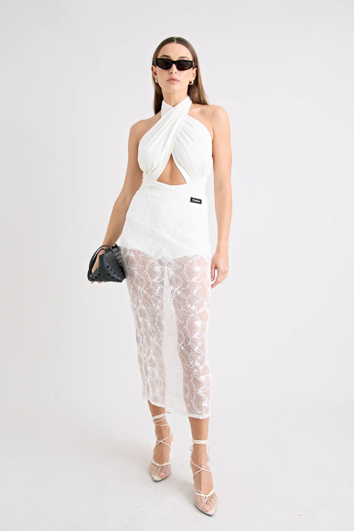 Victoria Top Powder by Pfeiffer, sculpting wrap-style jersey top with double lining and adjustable ties for a flattering, curve-hugging fit.