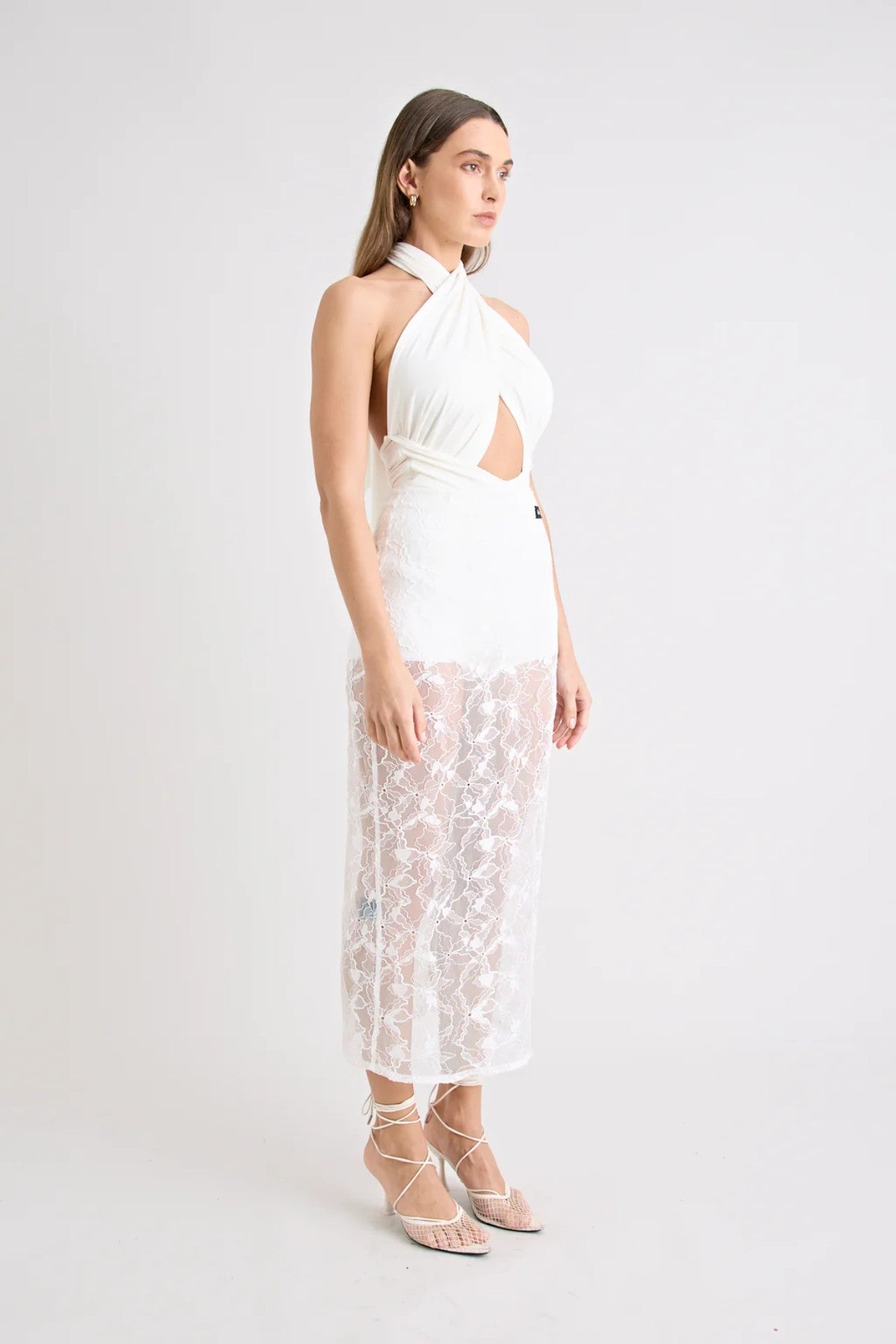 Victoria Top Powder by Pfeiffer, sculpting wrap-style jersey top with double lining and adjustable ties for a flattering, curve-hugging fit.