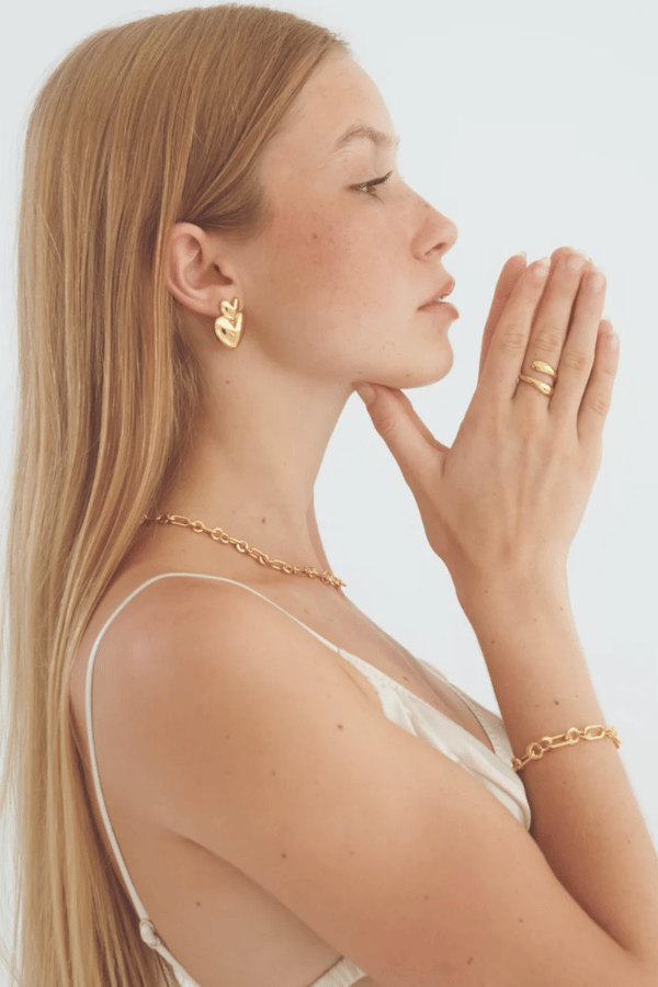 Vivienne Earrings in Gold by Avant Studio, gold heart earrings with retro design. Perfect for statement styling or everyday wear.