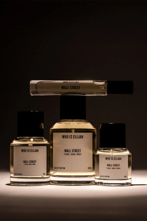 Wall Street by Who Is Elijah, a smoky, woody floral fragrance with rose, raspberry, Egyptian geranium, oud, incense, saffron, amberwood, and leather.