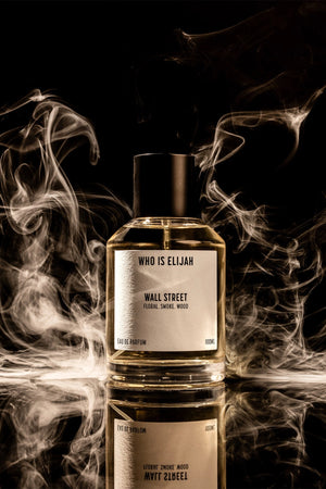Wall Street by Who Is Elijah, a smoky, woody floral fragrance with rose, raspberry, Egyptian geranium, oud, incense, saffron, amberwood, and leather.