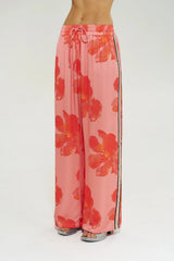 Wide Leg Pant Peach Petals by Your Brand, features oversized floral prints on a flowy peach base. Perfect for resort lounging or beach days.