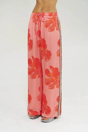 Wide Leg Pant Peach Petals by Your Brand, features oversized floral prints on a flowy peach base. Perfect for resort lounging or beach days.