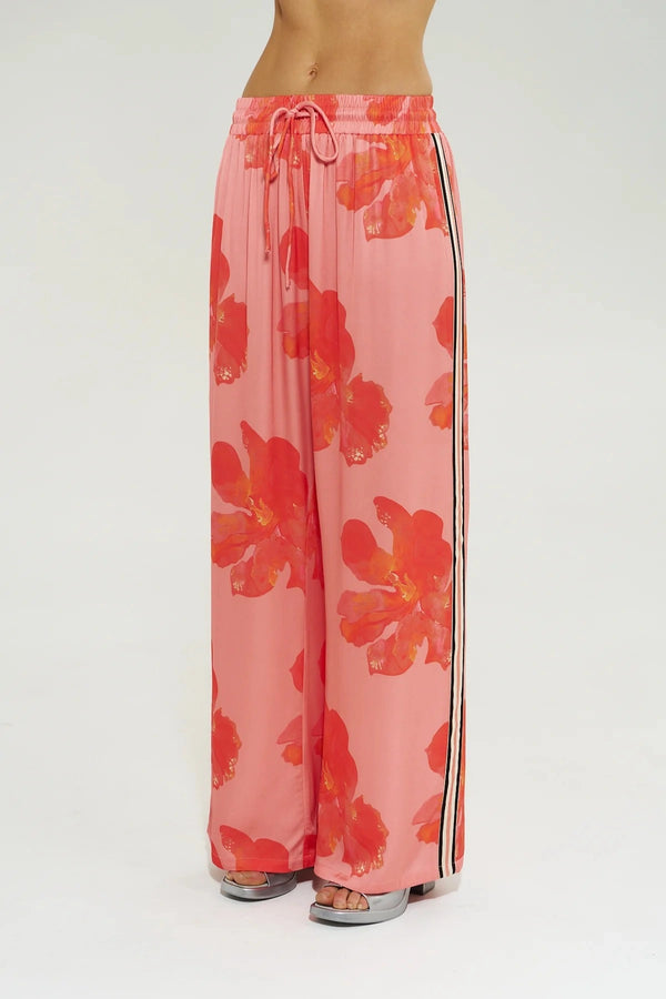 Wide Leg Pant Peach Petals by Your Brand, features oversized floral prints on a flowy peach base. Perfect for resort lounging or beach days.