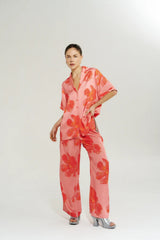 Wide Leg Pant Peach Petals by Your Brand, features oversized floral prints on a flowy peach base. Perfect for resort lounging or beach days.