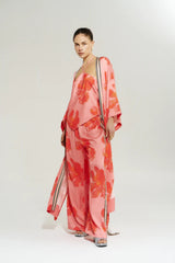 Wide Leg Pant Peach Petals by Your Brand, features oversized floral prints on a flowy peach base. Perfect for resort lounging or beach days.