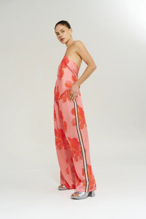 Wide Leg Pant Peach Petals by Your Brand, features oversized floral prints on a flowy peach base. Perfect for resort lounging or beach days.