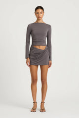 Wilder Dress Charcoal by Benni - stretch jersey mini dress with waist cut out and draped skirt, designed for a sleek sculpted silhouette.