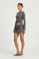 Wilder Dress Charcoal by Benni - stretch jersey mini dress with waist cut out and draped skirt, designed for a sleek sculpted silhouette.