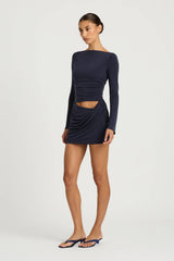 Wilder Dress Navy by Benni - stretch jersey mini dress with waist cut out and draped skirt, designed for a sleek sculpted silhouette.