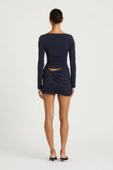 Wilder Dress Navy by Benni - stretch jersey mini dress with waist cut out and draped skirt, designed for a sleek sculpted silhouette.