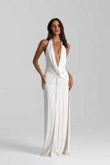 Winona Gown White by Natalie Rolt – a draped halter gown with open back and side split. Perfect for formal evening events.