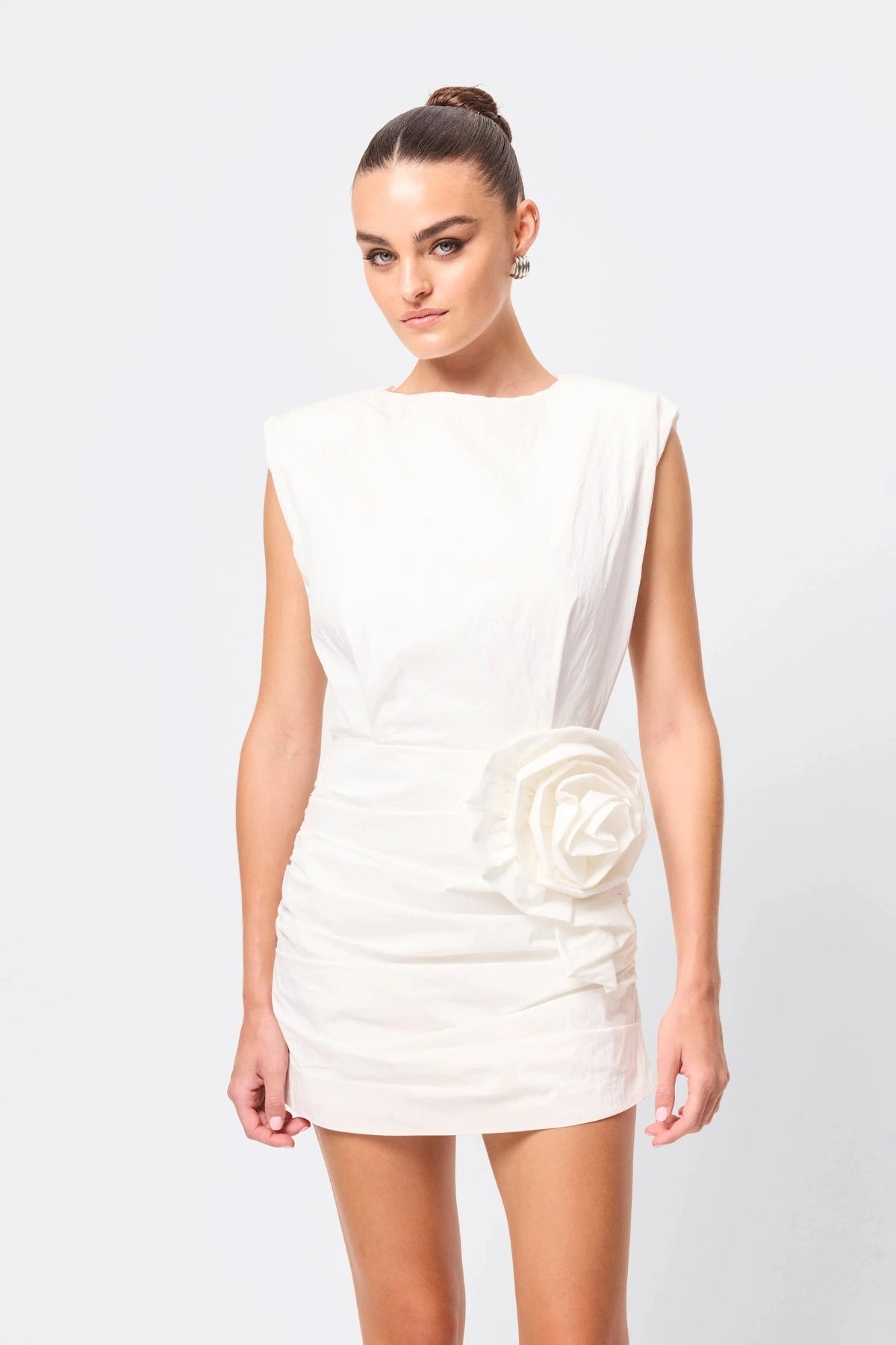 Wrapped In You Mini Dress White by Mossman, ruched mini with shoulder pads and rosette detail, a trendy piece perfect for bold evenings or events.