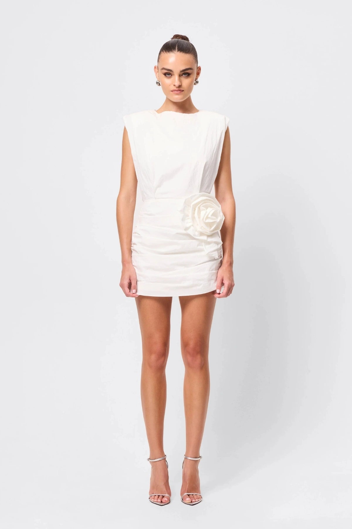 Wrapped In You Mini Dress White by Mossman, ruched mini with shoulder pads and rosette detail, a trendy piece perfect for bold evenings or events.