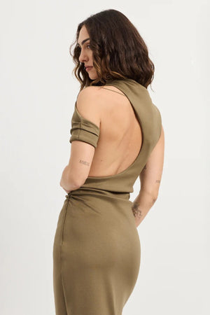 Xyla Dress by Tojhà – a clay jersey maxi with an asymmetric neckline, wrapped arm detail, and soft tucks, perfect for modern evening styling.