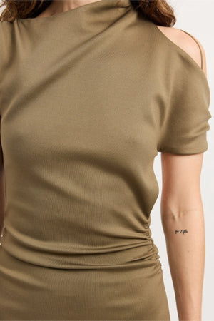 Xyla Dress by Tojhà – a clay jersey maxi with an asymmetric neckline, wrapped arm detail, and soft tucks, perfect for modern evening styling.