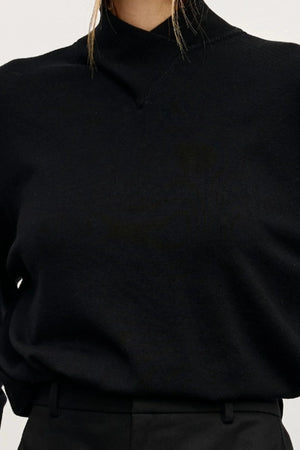 Yvette Knit Jumper Black by Bayse – relaxed fine knit jumper with crossover high neckline and dropped shoulders.