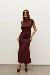 Yvone Midi Dress in Chocolate by Bayse, a fitted midi dress with a high neckline, waist ruching, and back cut-out detail.