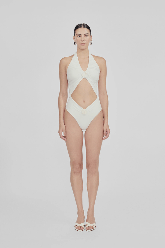 Zaguan One Piece Off White by Maygel Coronel, halter swimsuit with cutouts and floral detail. Perfect for beach days or resort styling.