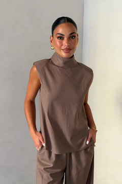Zoe Turtleneck Suit Top Taupe by Sneaky Link – a structured top with turtleneck and clean lines. Perfect for elevated styling.