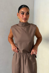 Zoe Turtleneck Suit Top Taupe by Sneaky Link – a structured top with turtleneck and clean lines. Perfect for elevated styling.