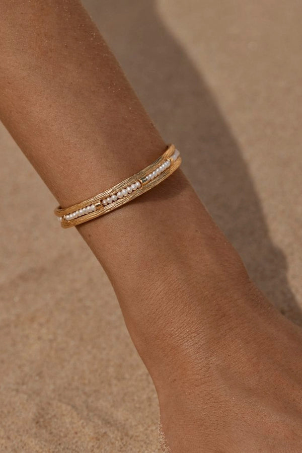 Zuni Bracelet by Amber Sceats - gold cuff bracelet with freshwater pearls, designed for a bold elevated statement look.