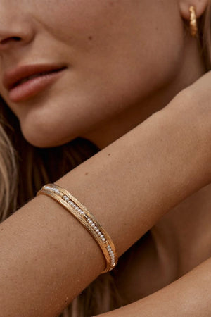 Zuni Bracelet by Amber Sceats - gold cuff bracelet with freshwater pearls, designed for a bold elevated statement look.