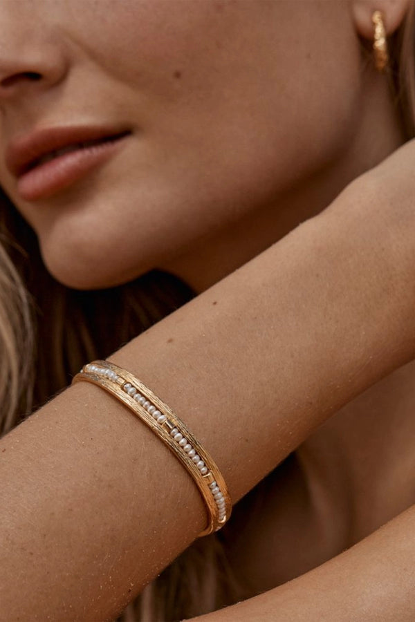 Zuni Bracelet by Amber Sceats - gold cuff bracelet with freshwater pearls, designed for a bold elevated statement look.
