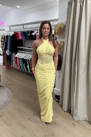 Hudson Lace Maxi Dress Butter by Benni, elegant stretch lace dress with twist halter neck, ruched seams, and sheer waist panel for a bold evening look.