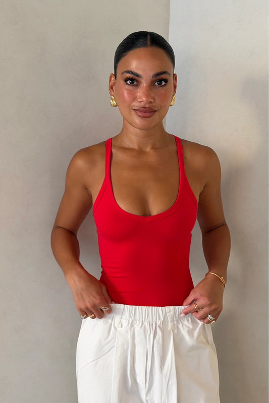 Red Aria Tank top with a fitted silhouette and scoop neckline displayed on a plain white background.