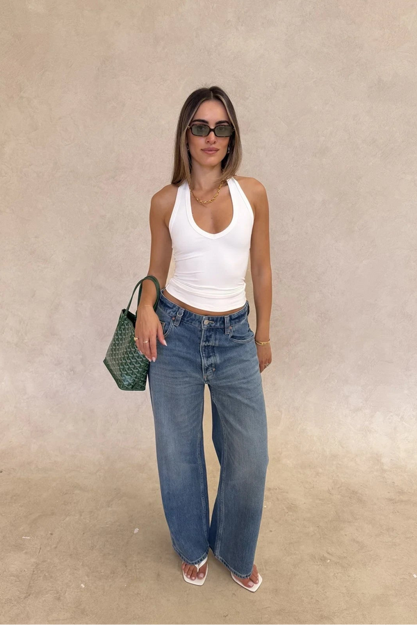 White Bronte halter tank top made of soft jersey fabric with a fitted silhouette and sleeveless design.