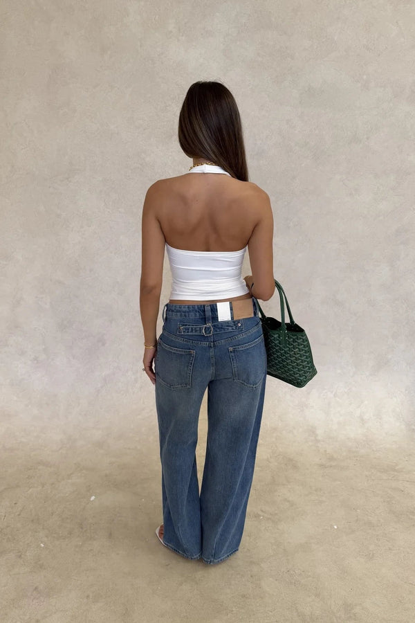 White Bronte halter tank top made of soft jersey fabric with a fitted silhouette and sleeveless design.